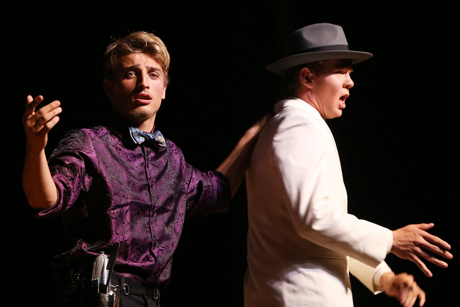Paulie the Barber, played by Aiden O’Neill, consoles Spade Malloy,